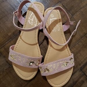 Pink strap sandals.